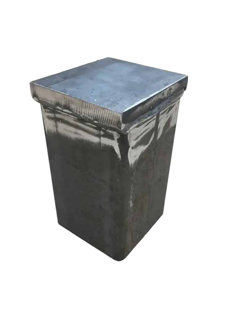 A 4x4 Post Driving Cap with a metal, rectangular form and fitted lid, showing a slightly weathered surface, isolated on a white background.