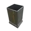 The 4x4 Post Driving Cap is a square, open-top metal tool with a weathered finish and solid base, shown on a white background.