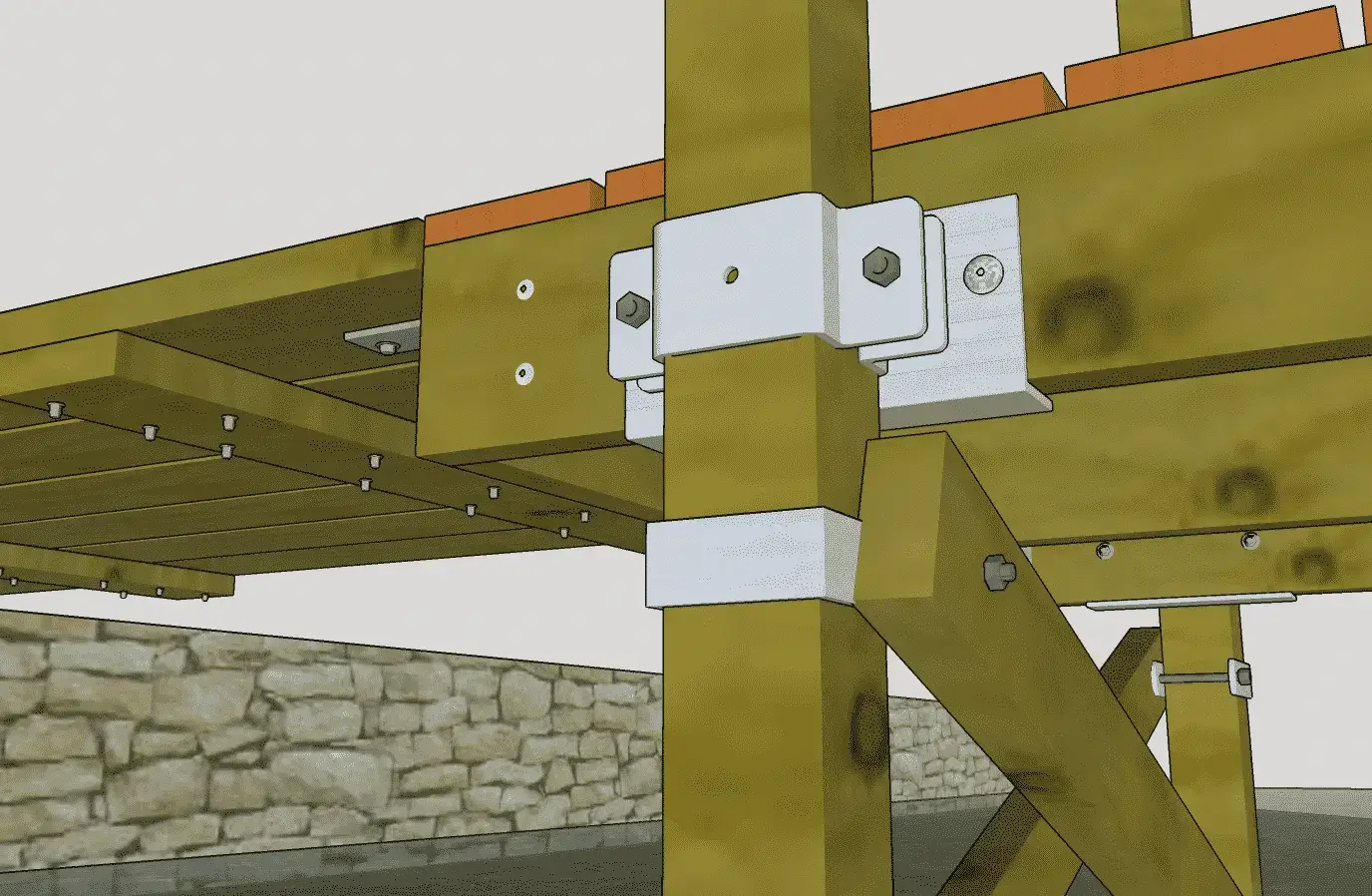 Close-up of a 4x4 Post Bracket securing vertical and horizontal beams in a wooden deck structure, with a stone wall in the background.