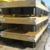 Three Dock Float Attachment Kit (Foam Filled) units from Great Northern Docks with wood frames and black floats, stacked outdoors on pavement near a building.