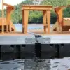 Eight Dock Hinge Bolts with Nylock Nuts by Great Northern Docks secure a Maine dock on a lake, ensuring durability and showcasing expert craftsmanship.