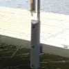 The Guardian Bumper with Pipe Bracket from Great Northern Docks protects metal docks from boats, while water remains visible below.