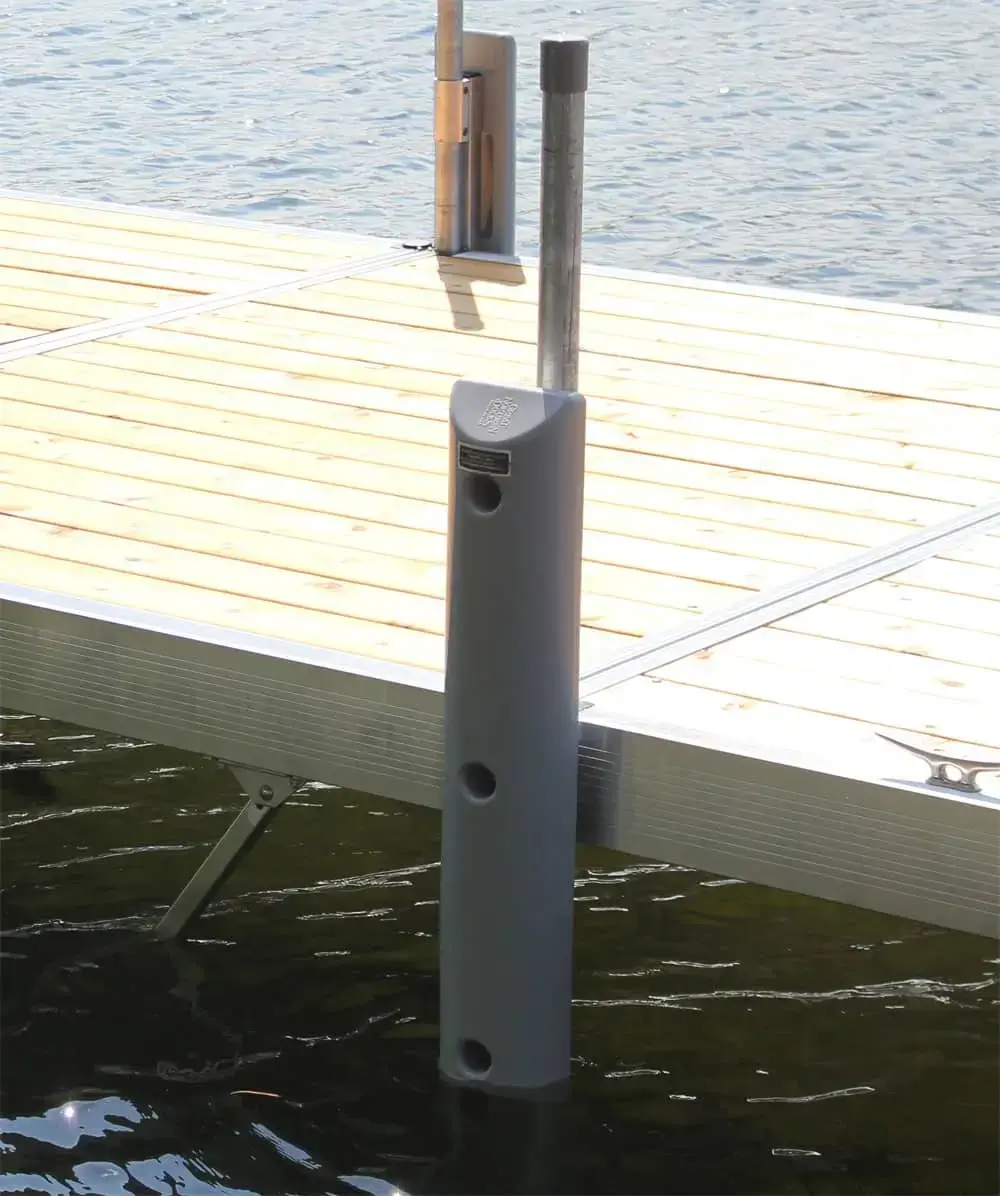 The Guardian Bumper with Pipe Bracket from Great Northern Docks protects metal docks from boats, while water remains visible below.