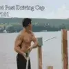 A shirtless man stands by water at Great Northern Docks, holding a post and looking at the 4x4 Post Driving Cap. Hills are visible in the background. Text: 4x4 Post Driving Cap.