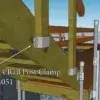 A wooden staircase on a Maine dock features a 2x4 Rail Post Clamp (4 pack) attached to the stair stringer, shown with a labeled arrow.