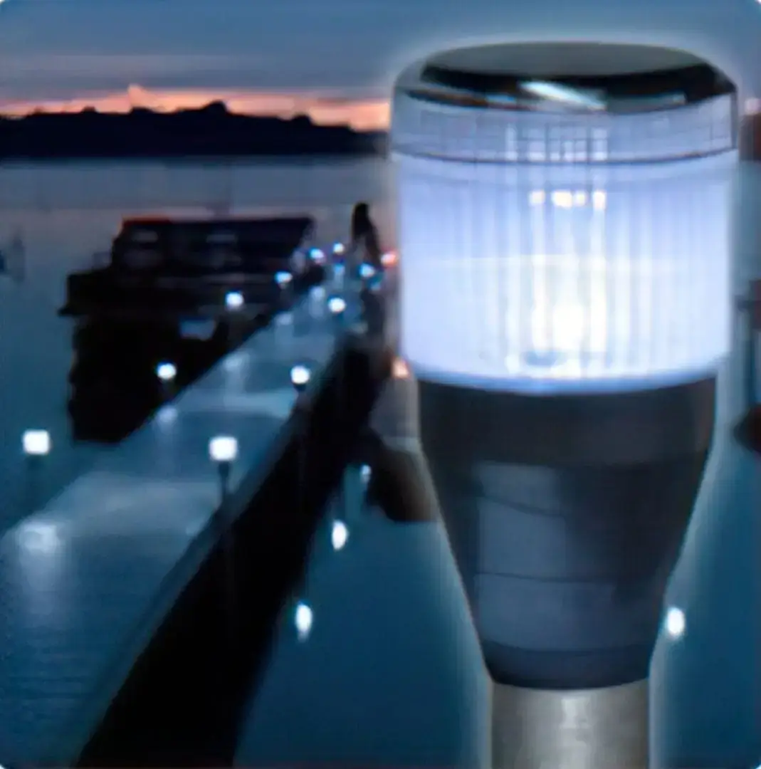 A close-up of a glowing Solar Dock Light (2 Pack) at dusk, with a blurred dock, water, and person in the background, showcasing Great Northern Docks.