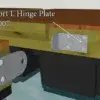 Illustration of a Short L Hinge Plate attached with screws to a Maine Docks wood dock edge above water, arrow indicating the hinge plate.