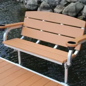 Swim Raft with cup holders on each armrest, placed on a Great Northern Docks wood dock above water, rocks in the background.