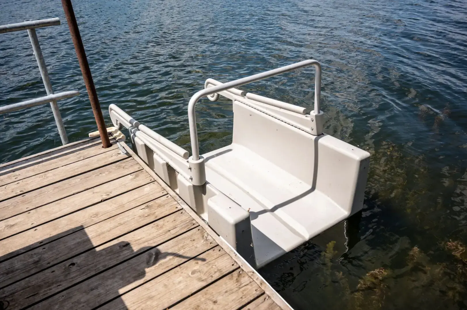 Z6H4673 A Kayak Launch - Connect-A-Dock sits partially submerged on a Great Northern Docks wood dock, providing accessible entry to the lake.