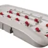 The Connect-A-Dock is a white floating dock section with a molded groove and red rollers for easy launching and docking of personal watercraft.
